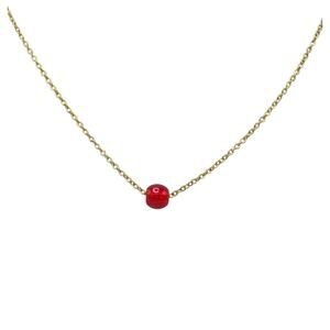 Vintage Necklace with a gold-tone chain and floating red glass bead